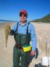 Chris on Fraser Island with his catch - a flathead