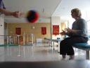 Jill playing catch in PE room