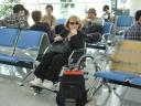 Jill waiting to board a Dragon air plane at Qingdao