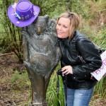 Kym with Paul''s hat on a Koala statue