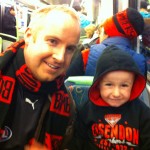 Riley & Dad on train to Football